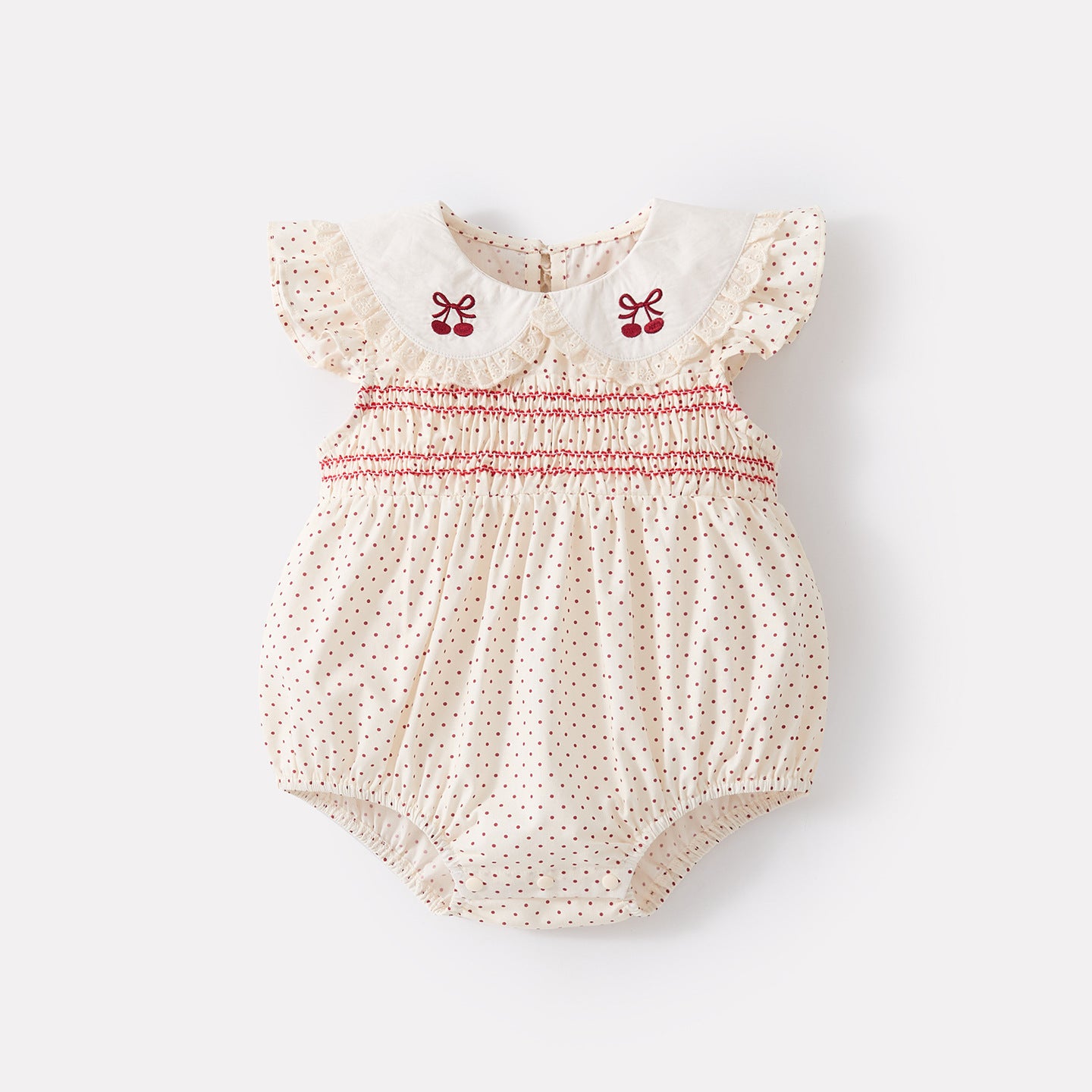 Polka dot romper with Peter Pan collar