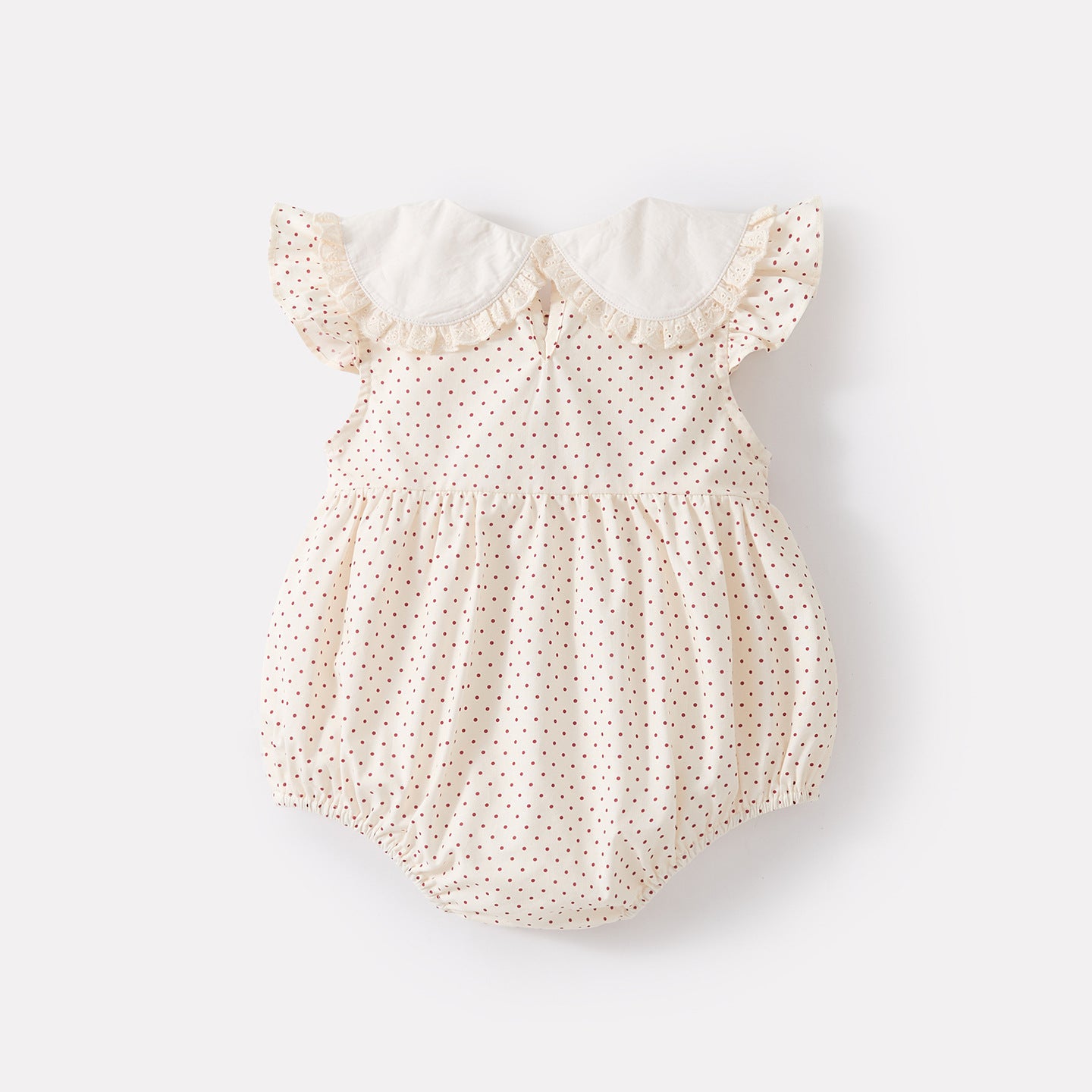 Polka dot romper with Peter Pan collar