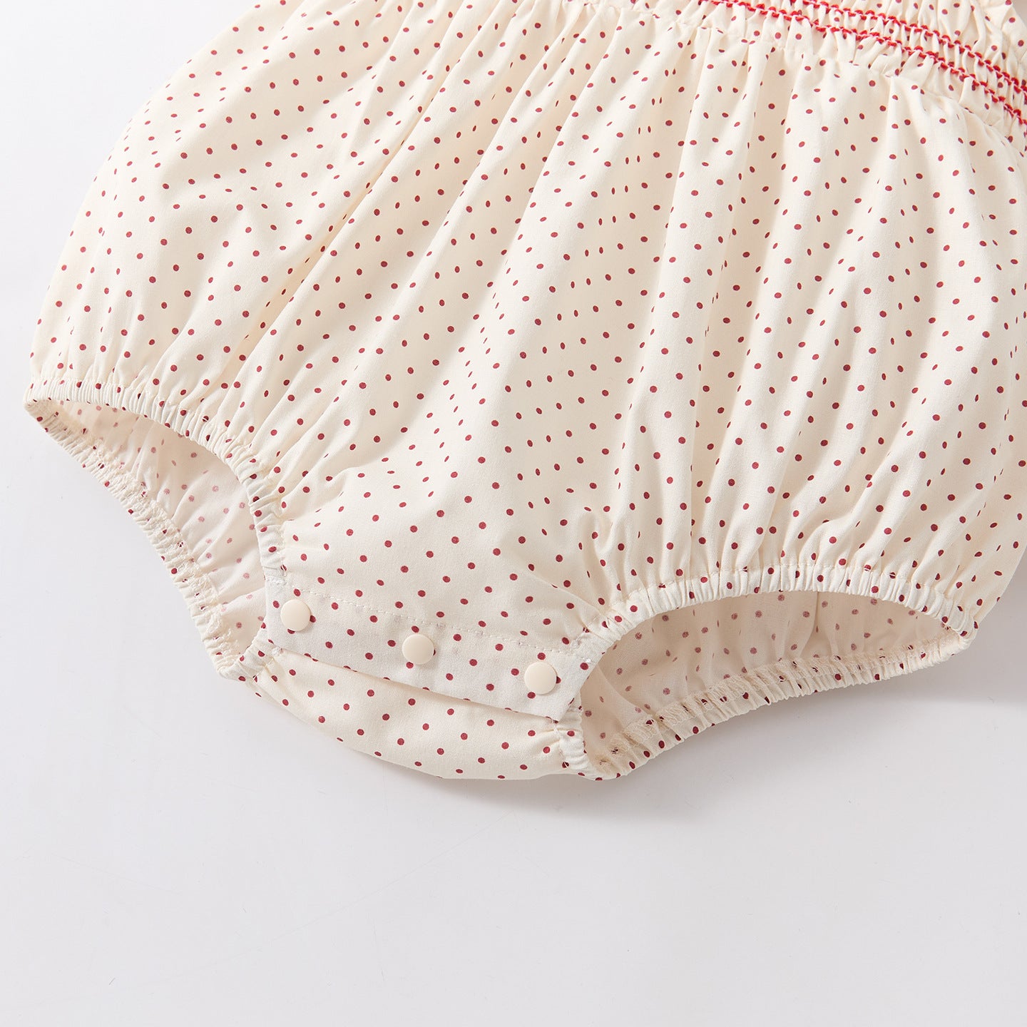 Polka dot romper with Peter Pan collar